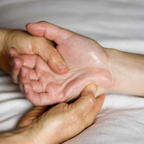 a pregnant woman who has just had reflexology treatment in Cardiff